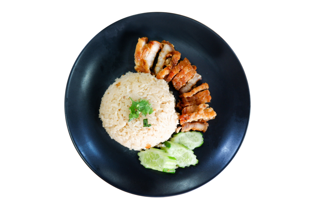 Crispy chicken served with rice and cucumber