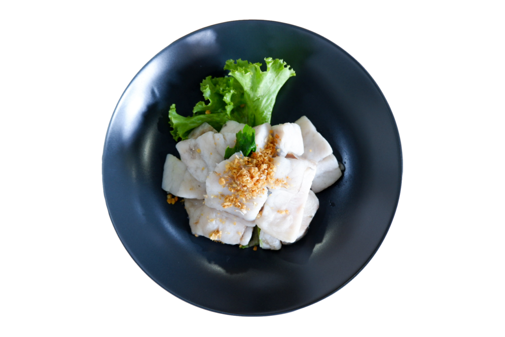 Steamed fish dish with garnish on plate