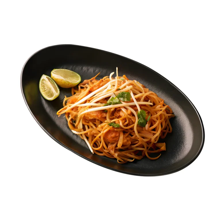 Authentic Pad Thai noodles served with fresh bean sprouts and lime on a sleek black plate