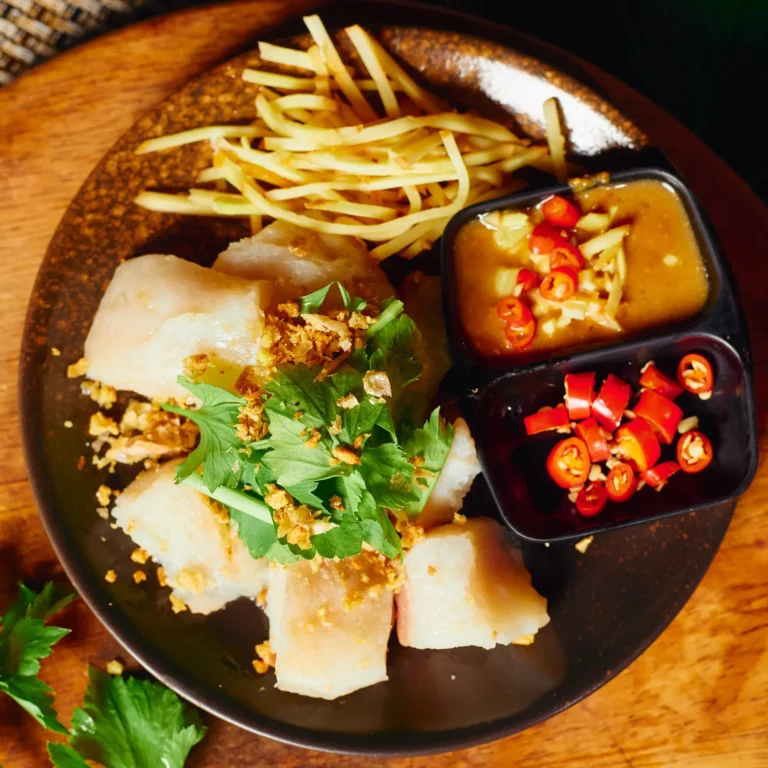 Steamed basa fish topped with fresh cilantro and crispy garlic, served with spicy chili and garlic-lime dipping sauces